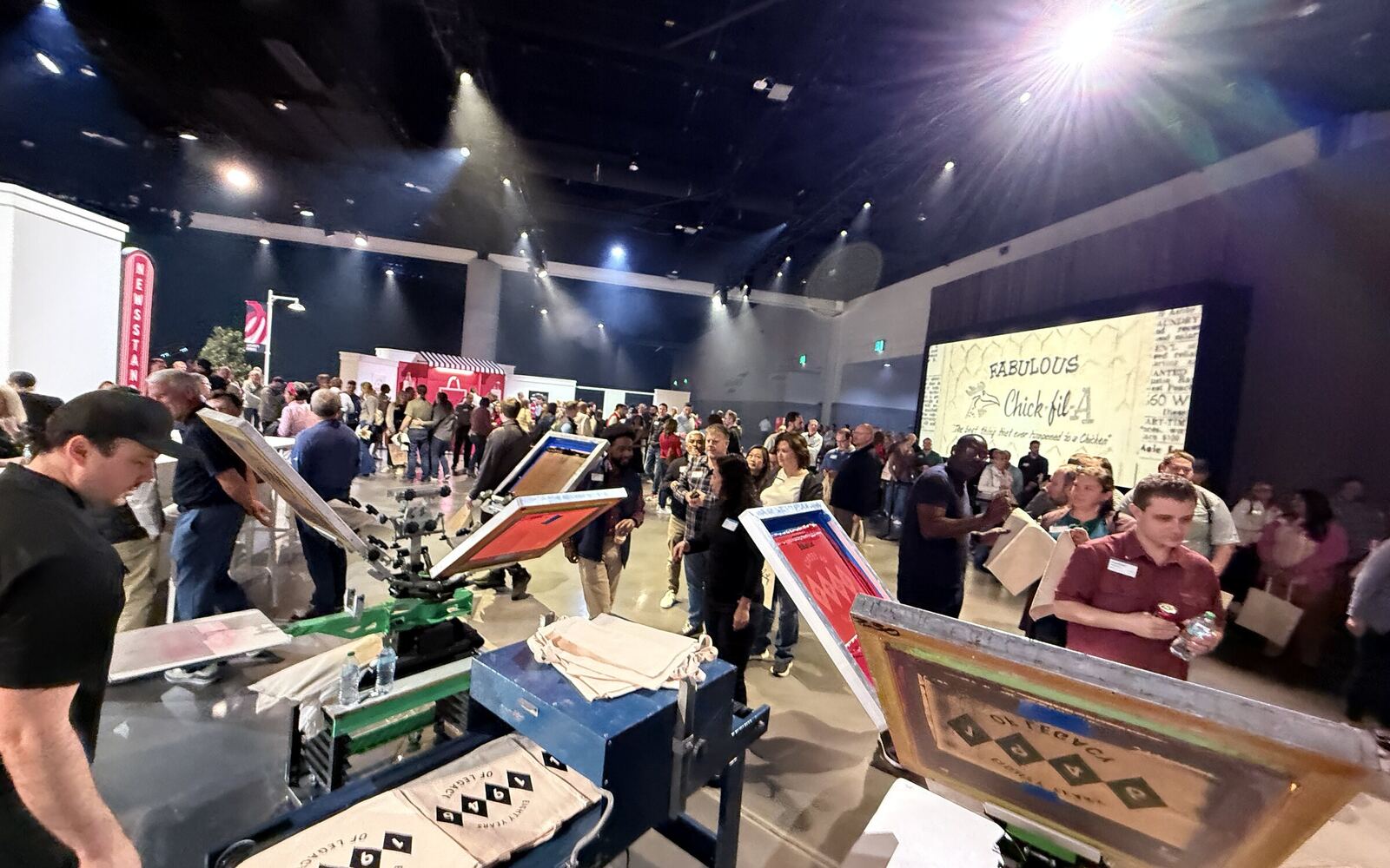 Operator heat pressing a full-color transfer at a corporate event