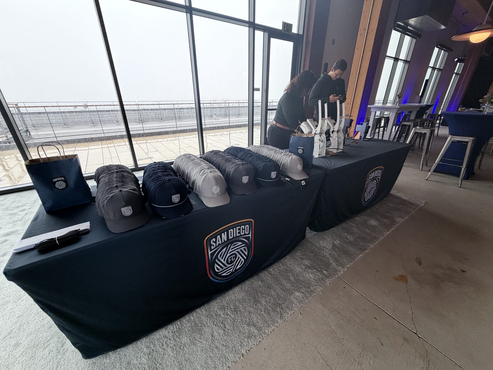 Custom caps arranged for guests to personalize at a cap bar